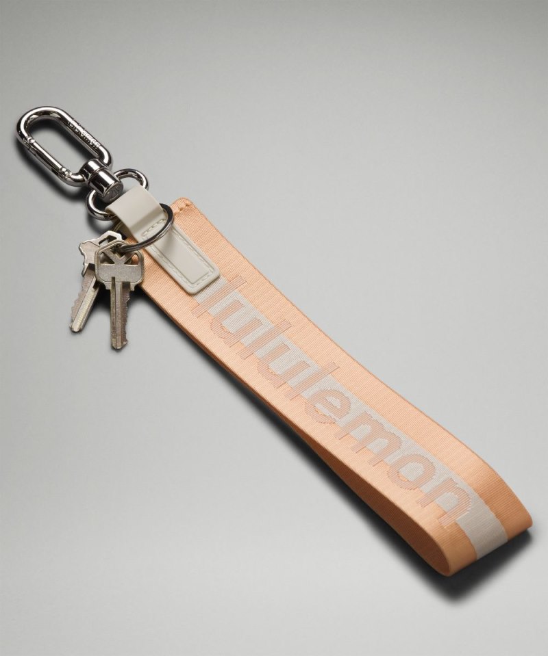 Lululemon Never Lost Keychain *Wordmark Peach Bellini / White Opal / White Online Outlet Sale